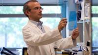 Anthony W. Ferrante Jr. MD, PhD working in lab